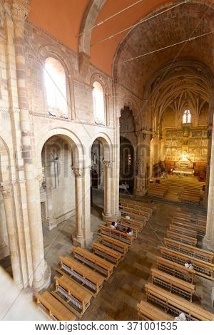 Leon, Spain - June 27, 2017: Parishioners praying in the basilica of san Isidoro.