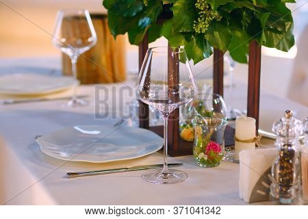 Elegant Restaurant Table Setting Service For Reception With Reserved Card.
