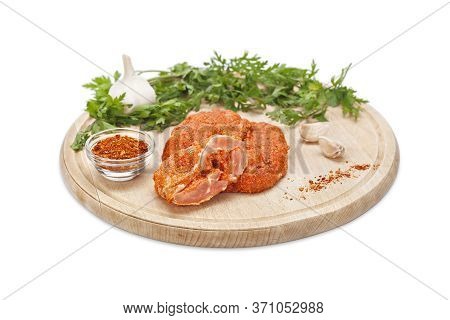 Raw Crispy Chicken Boneless Drumstick Breaded In Ground Chili Pepper And Bread Crumbs On A Wooden Bo