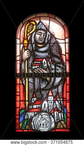 HOHENBERG, GERMANY - MAY 06, 2014: Saint Benedict, stained glass window by Sieger Koder in St. James church in Hohenberg, Germany