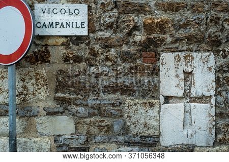 Bell Tower Alley (vicolo Campanile) And Ecclesiastical Coat Of Arms At The Church Of Medieval Villag