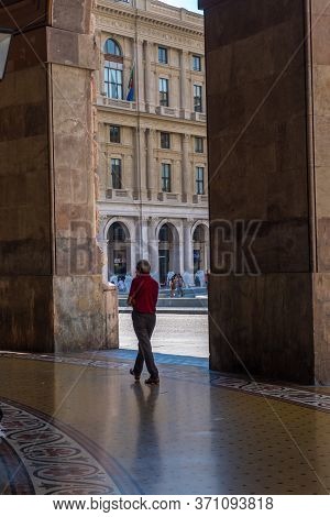Genoa, Italy - August 18, 2019: Tourist Walking Under Arches Of Via Xx Setembre, The Main Boulevard 