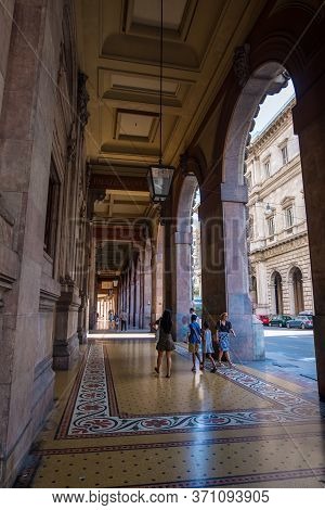 Genoa, Italy - August 18, 2019: Tourists Walking Under Arches Of Via Xx Setembre, The Main Boulevard
