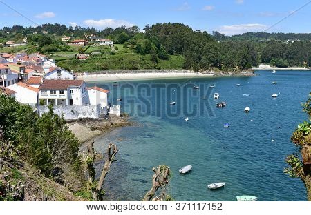 Small Fishing Village With Boats And Beach. Redes, Galicia, Spain.