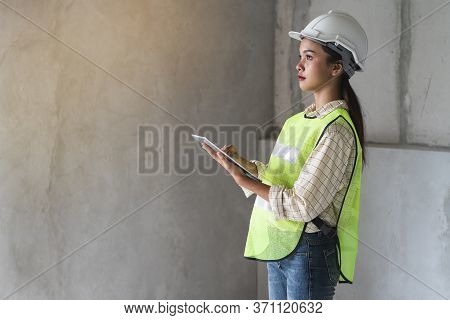 Female Worker Occupation. Woman Inspector / Architect Checking Interior Material Process In House Re