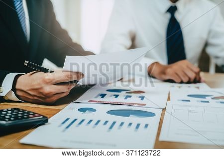 Financial Advisory Services. Asian Advisor Showing Plan Of Investment To Clients In The Consultancy 