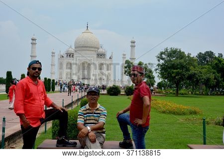 Agra, Uttar Pradesh, India, 9th August, 2018:   Indian Tourist Posing For Photograph Before The Famo