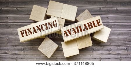 Business Concept. On A Wooden Background Blocks With The Text Funding Available