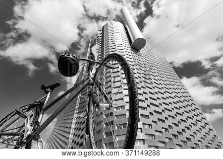 Copenhagen. Denmark. July 23, 2019. Bicycle In Front Of The Facade Of A Modern Metal Building. Black