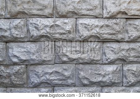 stone wall made of gray slabs as a natural background