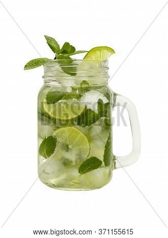 Close Up One Full Big Mason Jar Glass Of Mojito Cocktail With Mint Leaves, Lime Slices And Ice Cubes