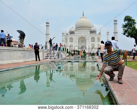 Agra, Uttar Pradesh, India, 9th August, 2018:   Indian Tourist Posing For Photograph Before The Famo