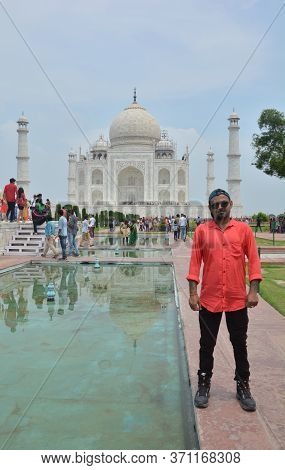 Agra, Uttar Pradesh, India, 9th August, 2018:   Indian Tourist Posing For Photograph Before The Famo
