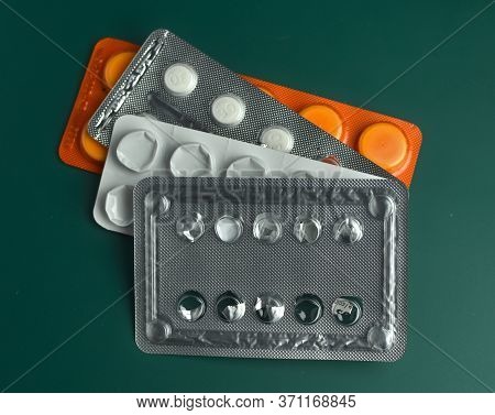 Heath, Healthcare Costs, Drugs, Medicines And Pills. Stack Of Four, Mostly Empty, Pill Blisters. Col