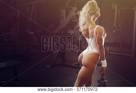 Fitness Woman With Protein Powder Workout In Gym