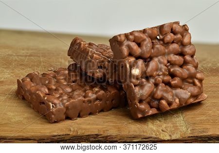 Nutrition, Diet And Junk Food. Chocolate Crispies Sweets Staked One Next To The Other.