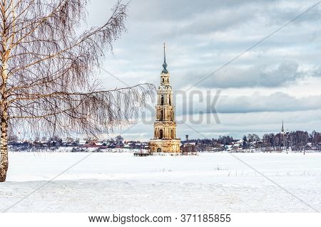 Ancient Bell Tower Of The Flooded Church On The Volga In Kalyazin. Winter Landscape With A Flooded B