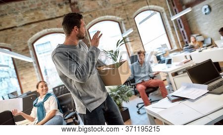 Follow Your Dreams, Quit Your Job. Handsome Man In Casual Wear Holding Box With Personal Things And 