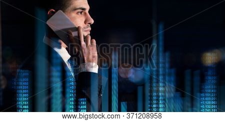 Young Caucasian Entrepreneur Talking On Smartphone On Dark Background, Collage With Finance Nimbers 