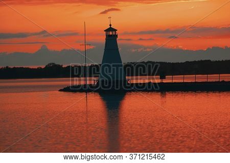 A Beautiful Lighthouse In The Sunset In Vadstena