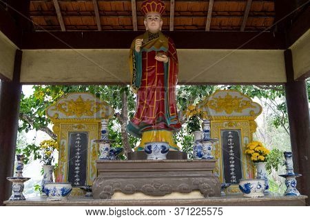 Nha Trang, Vietnam - March 28, 2016: Ritual Figurine In An Asian Cemetery