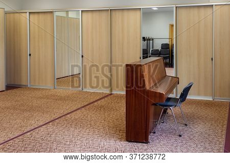 Empty Repetition Room With Lonely Piano And Chair