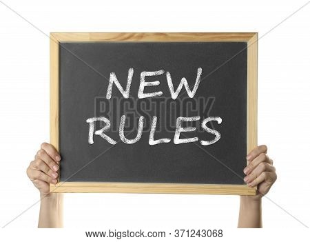 Woman Holding Blackboard With Text New Rules On White Background, Closeup
