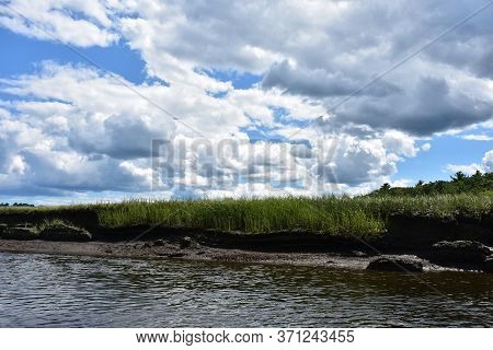 Lovely Landscape With A Marsh And A Tidal River.