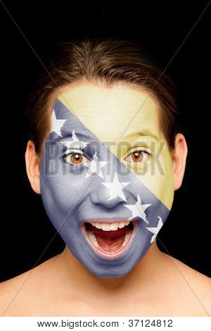 portrait of girl with Bosnia Herzegovinan flag painted on her face