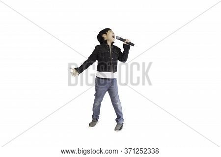 A Portrait Of A Cute Asian Elementary School Boy Wearing A Pair Of Jeans And A Black Jacket Enjoying