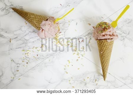 Two Cornets With Strawberry Ice Cream
