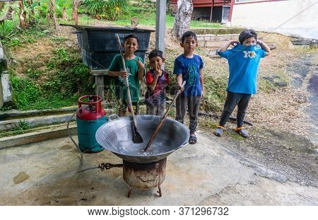 Cooking Traditional Malaysian Sweet Desert, Dodol By The Villagers During Hari Raya.