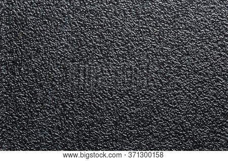 Flat Black Rugged Plastic Or Rubber Surface With Decorative Bumpy Finish