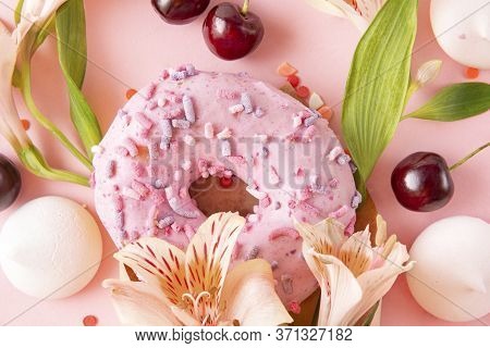 1 Donut With Pink Glaze, French Cookies  Meringues, Yellow Alstroemeria Flowers, Maroon Cherries On 