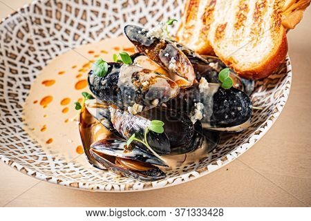 Plate of mussels with creme dubarry in restaurant