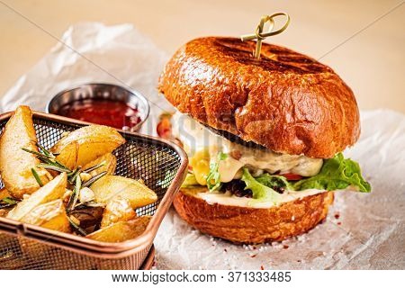 burger with tomato sauce and baked potato