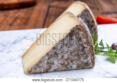 Cheese Tomme De Montagne Or Tomme De Savoie Made From Cow Milk In French Alps.
