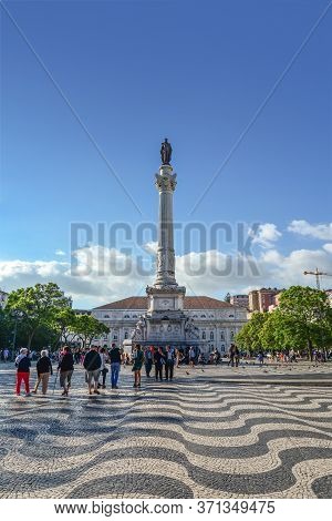 Lisbon, Portugal - July 2, 2019: Tourists At The Popular Rossio Square (also Known As Pedro Iv Squar
