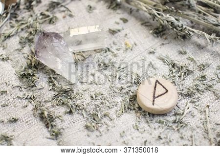 Scandinavian Wooden Rune Wunjo On A Rough Linen Cloth With Amethyst Crystalline, Rock Crystal And Dr