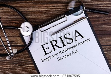 Erisa The Employee Retirement Income Security Act Text Is Written On A Tablet Lying On A Dark Table 