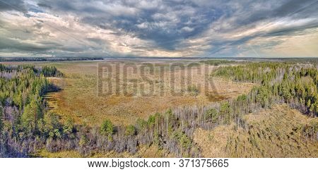 aerial view of northern peat swamp under sky with clowds