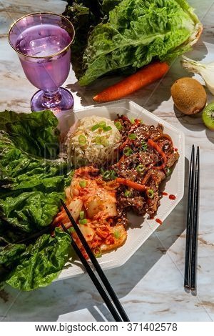 Korean Beef Bulgogi Ssambap Lettuce Wraps With Spicy Kimchi And Gochujang Hot Sauce