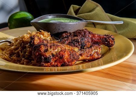 Peruvian Chicken Legs With Aji Verde Green Cilantro Sauce And Fried Rice
