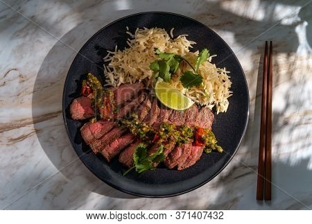 Rib-eye Steak Cooked Rare With Hot And Spicy Thai Crying Tiger Sauce Also Called Suea Rong Hai