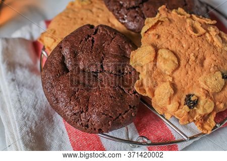 Oatmeal Cookie Milk Cookie And Chocolate Chip Nut Cookie On Grate Metal Red And White Napkin Black B