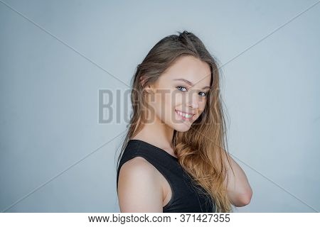 Young Beautiful Cute Cheerful Girl Smiling Looking At Camera Over White Background. Portrait Of Happ