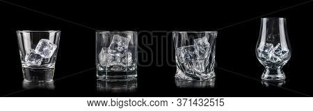 Set Of Four Glasses With Cub Ice For Alcoholic Drinks On Black Background