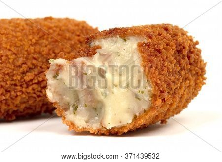 Partly Eaten Brown Crusty Dutch Kroket Isolated On A White Background