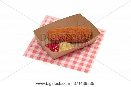 Brown Crusty Dutch Kroket With Mustard And Ketchup Isolated On A White Background