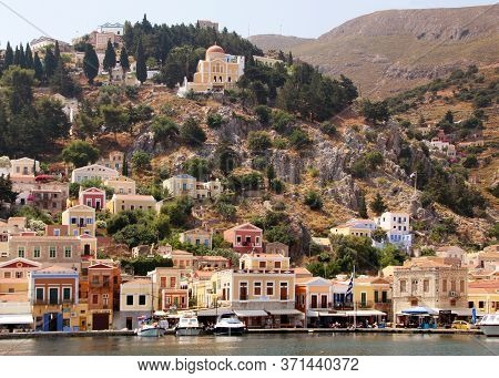Symi, Greece - June 05, 2020: Symi Town, Symi Island, Pictorial View Of Colorful Houses And The Harb